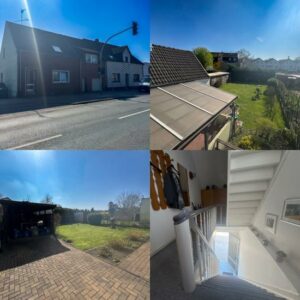 Ein Haus mit einem schönen Garten, einer großen Terrasse und einer geräumigen Garage.